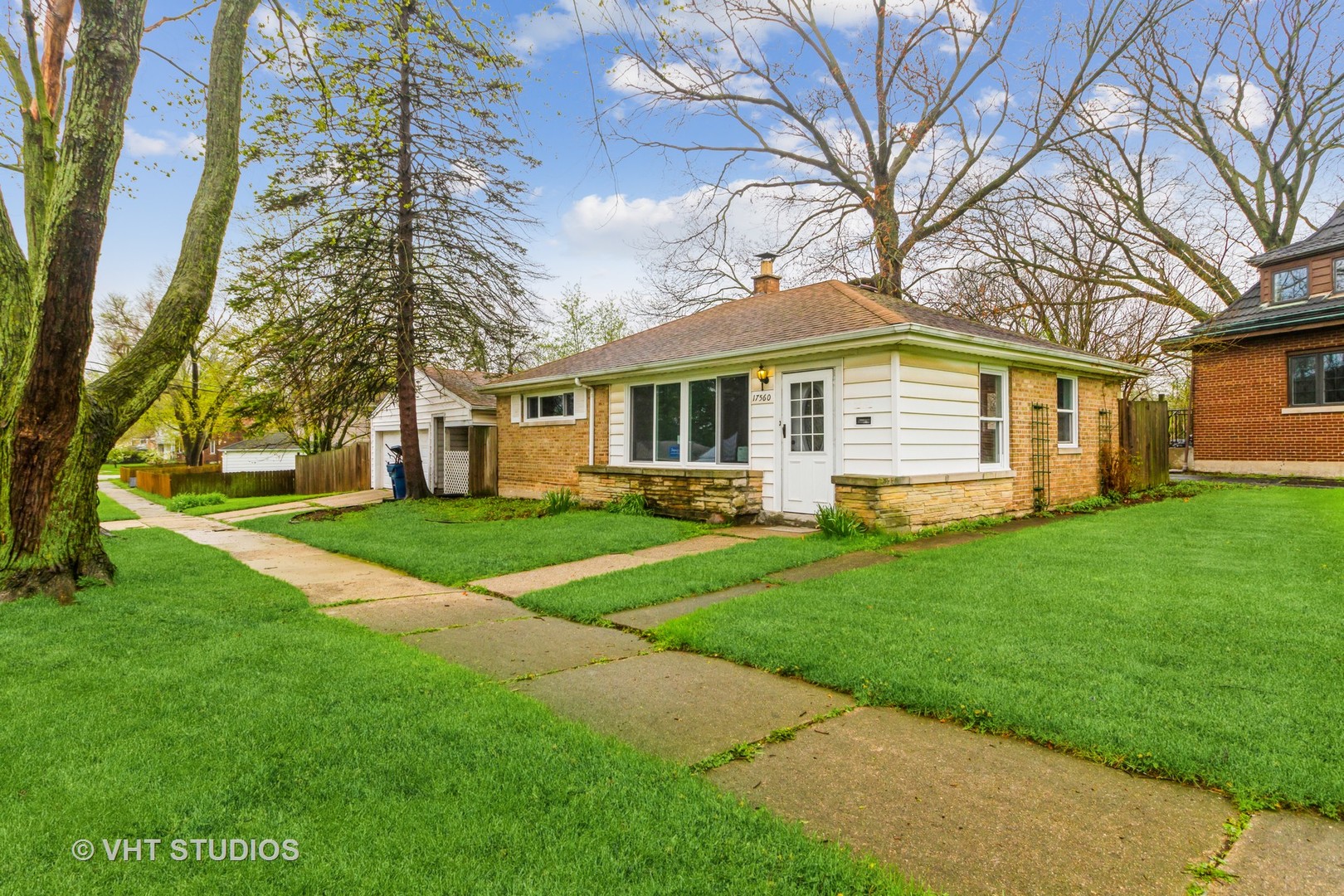 17560 Sycamore Drive Homewood, IL 60430 - Photo 2 of 13 a front view of house with yard and green space