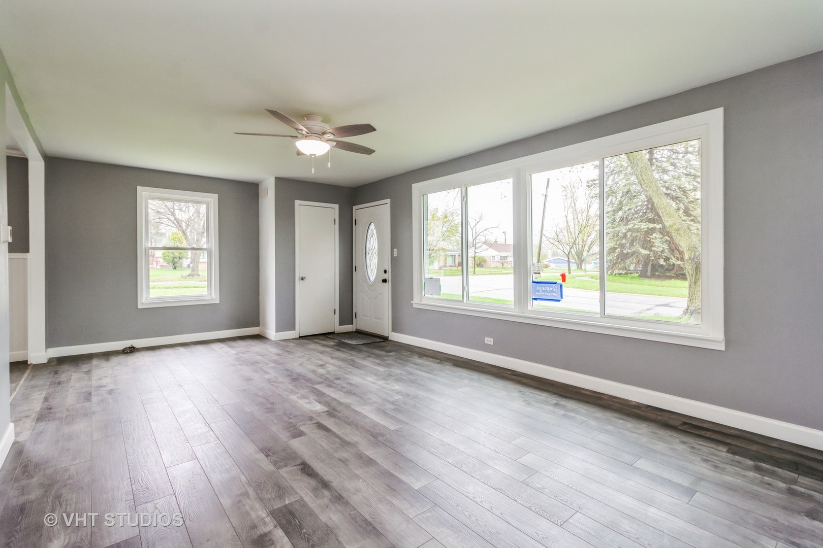 17560 Sycamore Drive Homewood, IL 60430 - Photo 4 of 13 a view of an empty room with wooden floor and a window