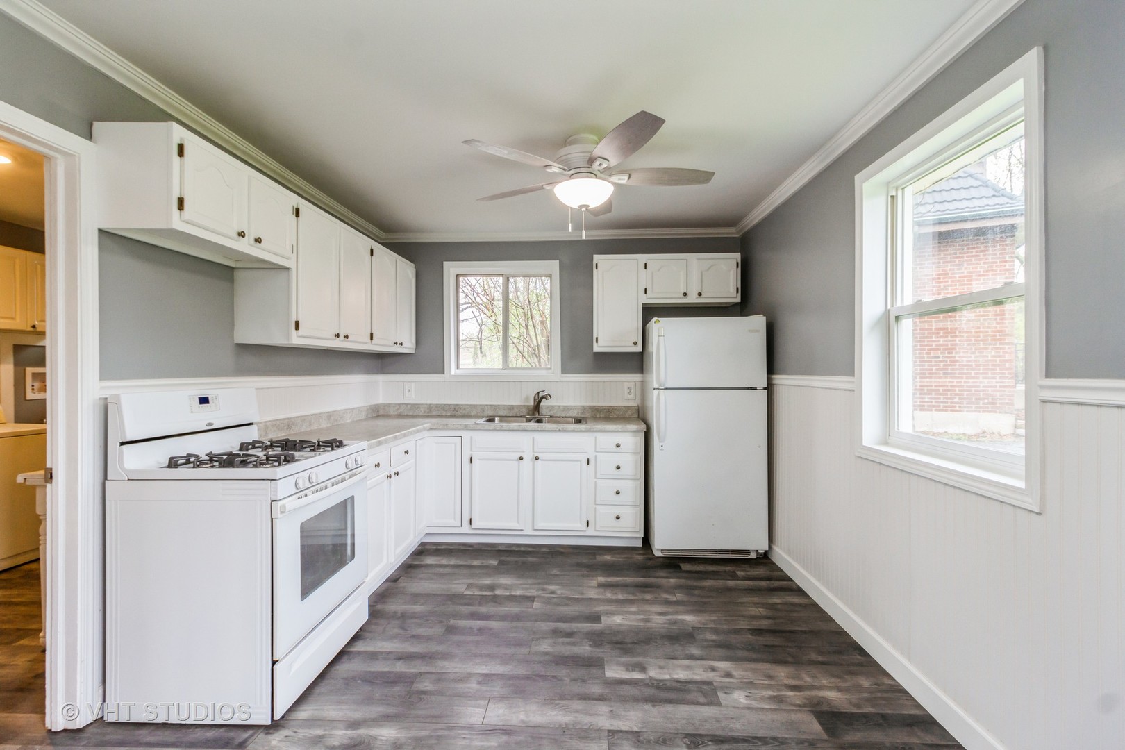 17560 Sycamore Drive Homewood, IL 60430 - Photo 5 of 13 a kitchen with granite countertop white cabinets and white appliances