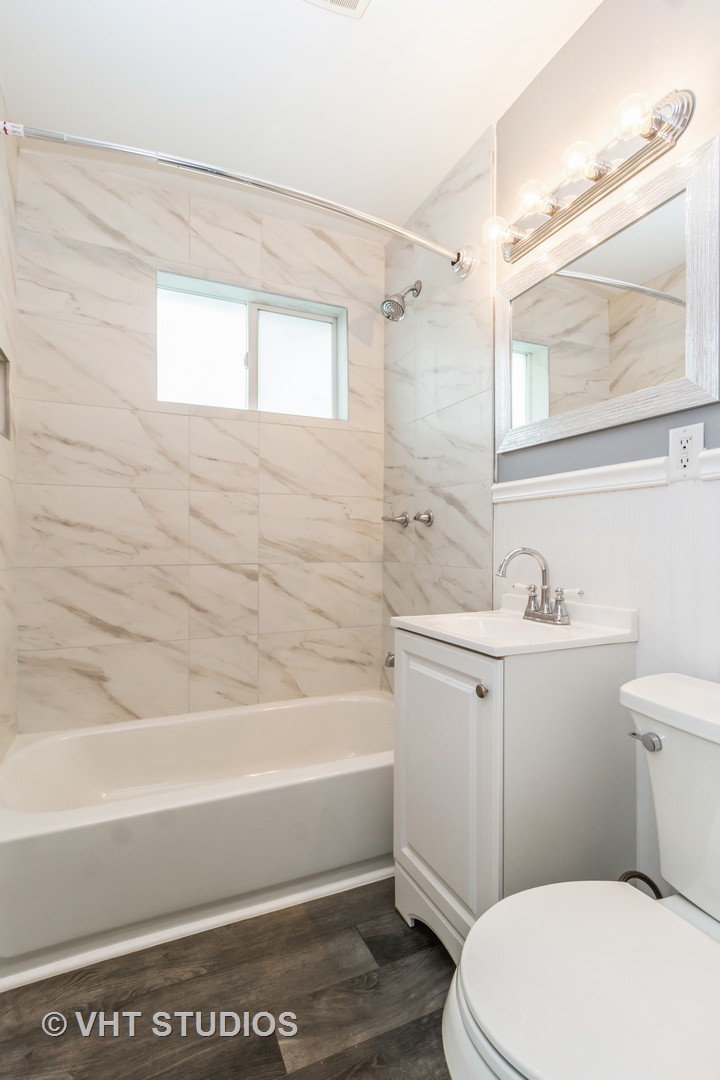 17560 Sycamore Drive Homewood, IL 60430 - Photo 9 of 13 a bathroom with a sink a toilet and bathtub