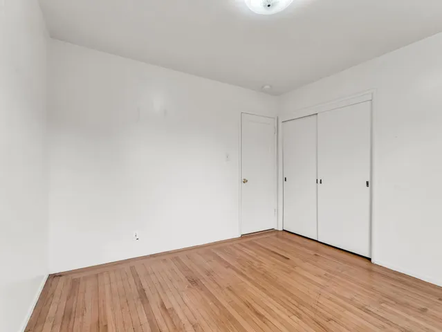a kitchen with granite countertop a stove a sink and a microwave
