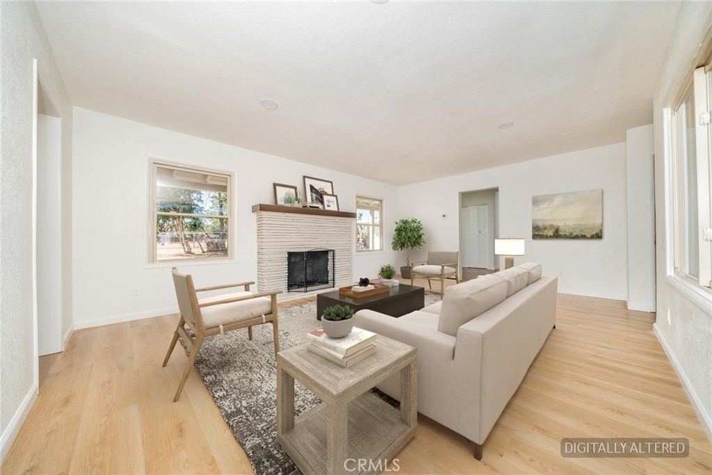 14387 Jicarilla Road Apple Valley, CA 92307 - Photo 4 of 24 Living Room (Disclaimer: Some images have been digitally enhanced with virtual staging to illustrate potential room layouts and furnishings. Actual property condition and features may vary. Buyer to verify all information independently).