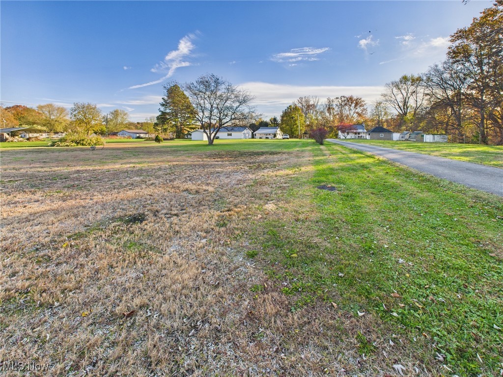 207 Stone Oak Road Davisville, WV 26142 - Photo 20 of 22 View of yard including mobile home lot with utility hook up