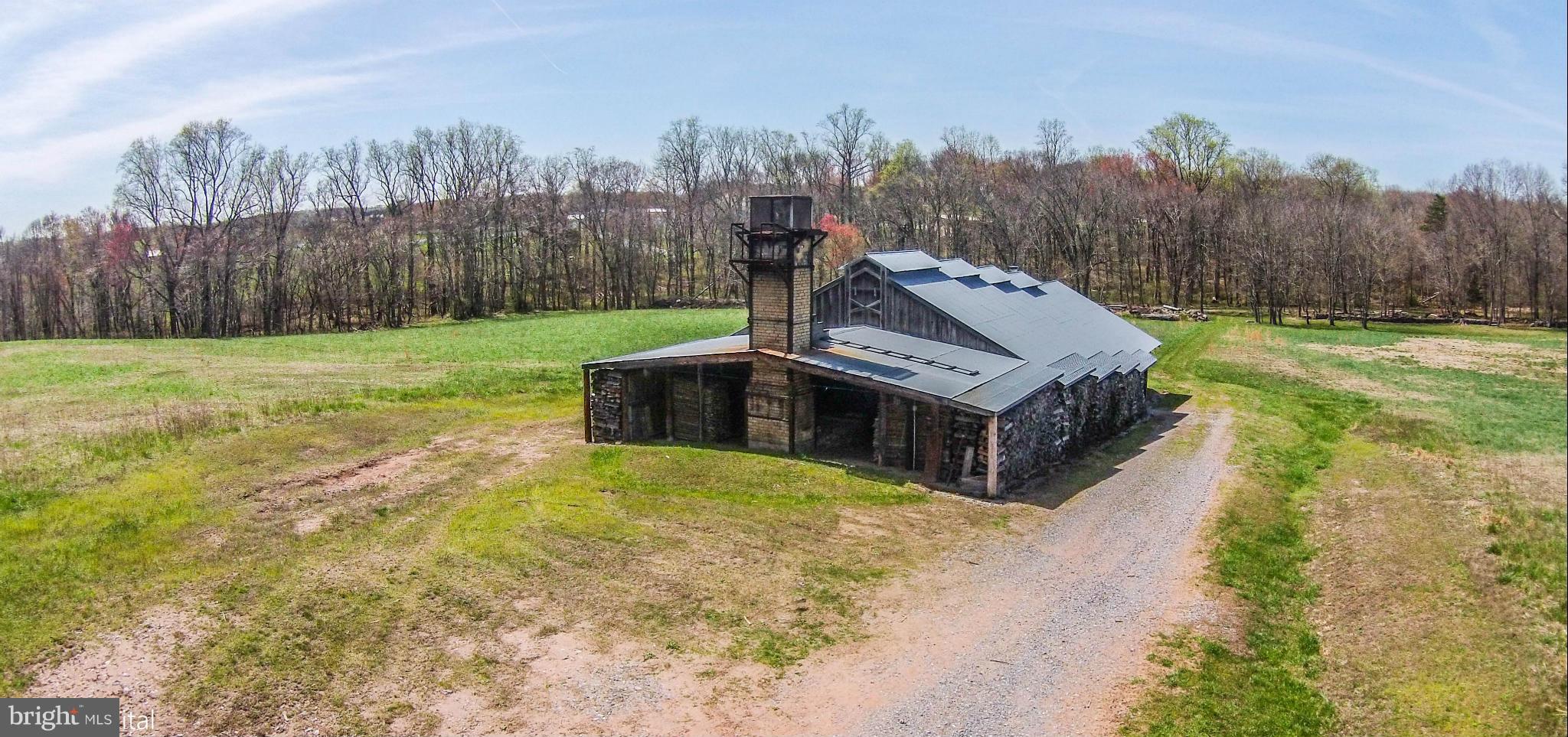 17300 White Ground Road Boyds, MD 20841 - Photo 10 of 18 a view of a house with a big yard and large trees