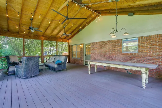 a reading room with furniture and wooden floor