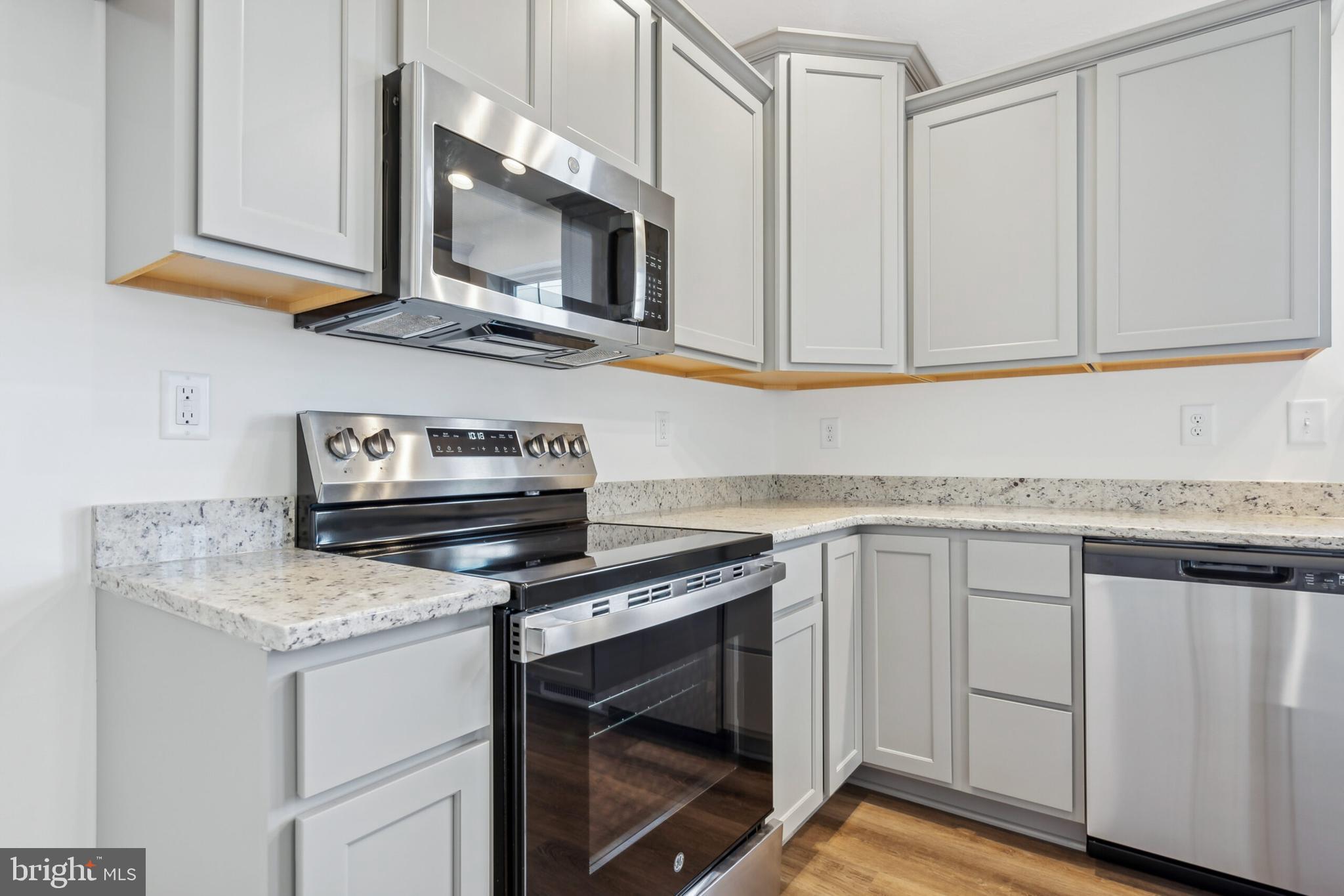 108 Flint Drive Hanover, PA 17331 - Photo 10 of 15 a kitchen with white cabinets and appliances