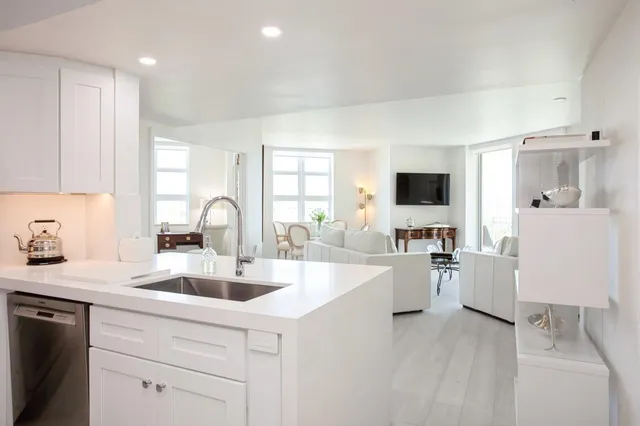 a kitchen with a sink cabinets and window