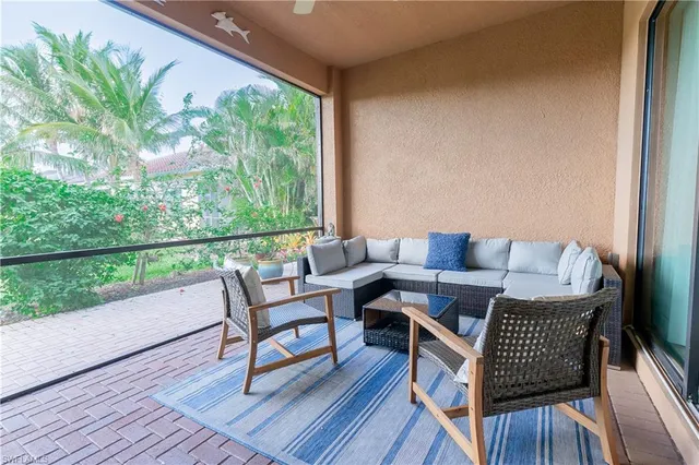 a roof deck with a table and chairs