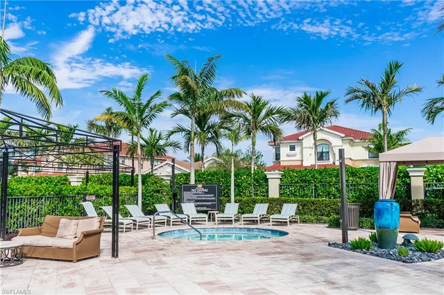 a building outdoor space with patio furniture and potted plants