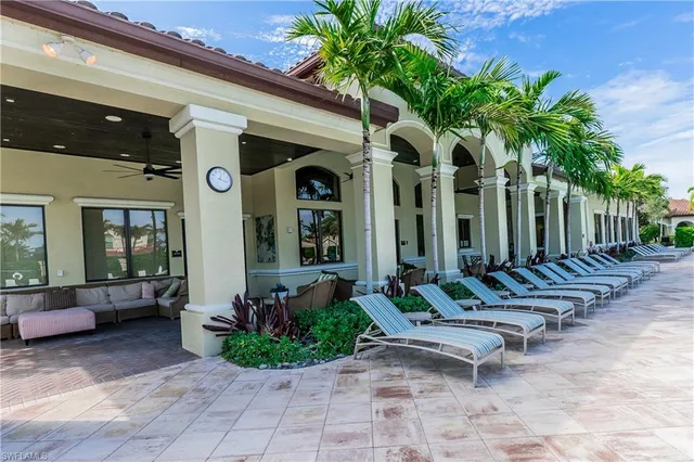 a view of a patio with furniture and yard