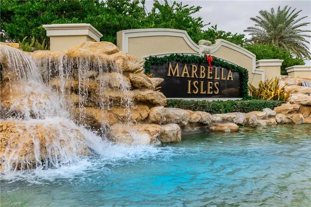 a view of an empty room with wooden floor and windows