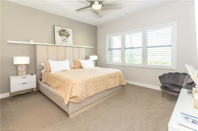 a spacious bedroom with a bed and a couch