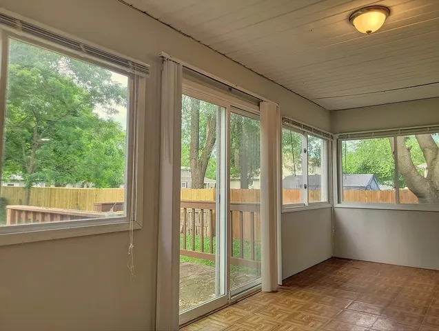 a view of an empty room and window