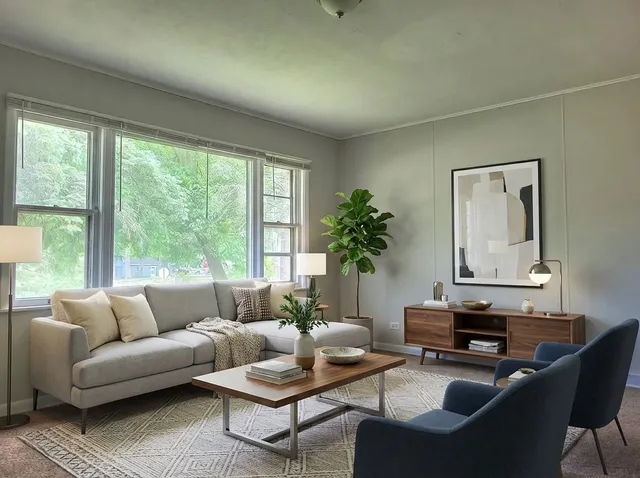a living room with furniture and a large window