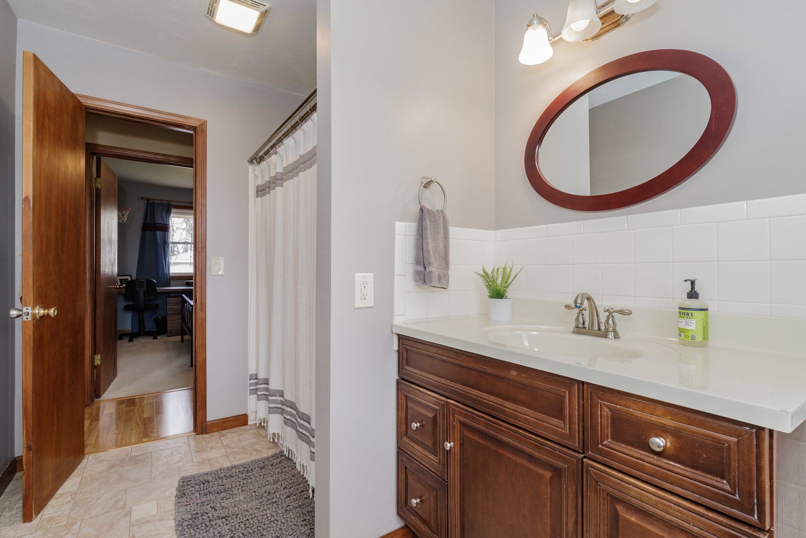 15 Robinwood Drive Normal, IL 61761 - Photo 20 of 35 a bathroom with a granite countertop sink and a mirror