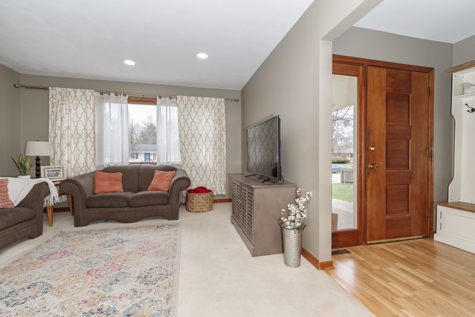 15 Robinwood Drive Normal, IL 61761 - Photo 4 of 35 a living room with furniture a flat screen tv and a window