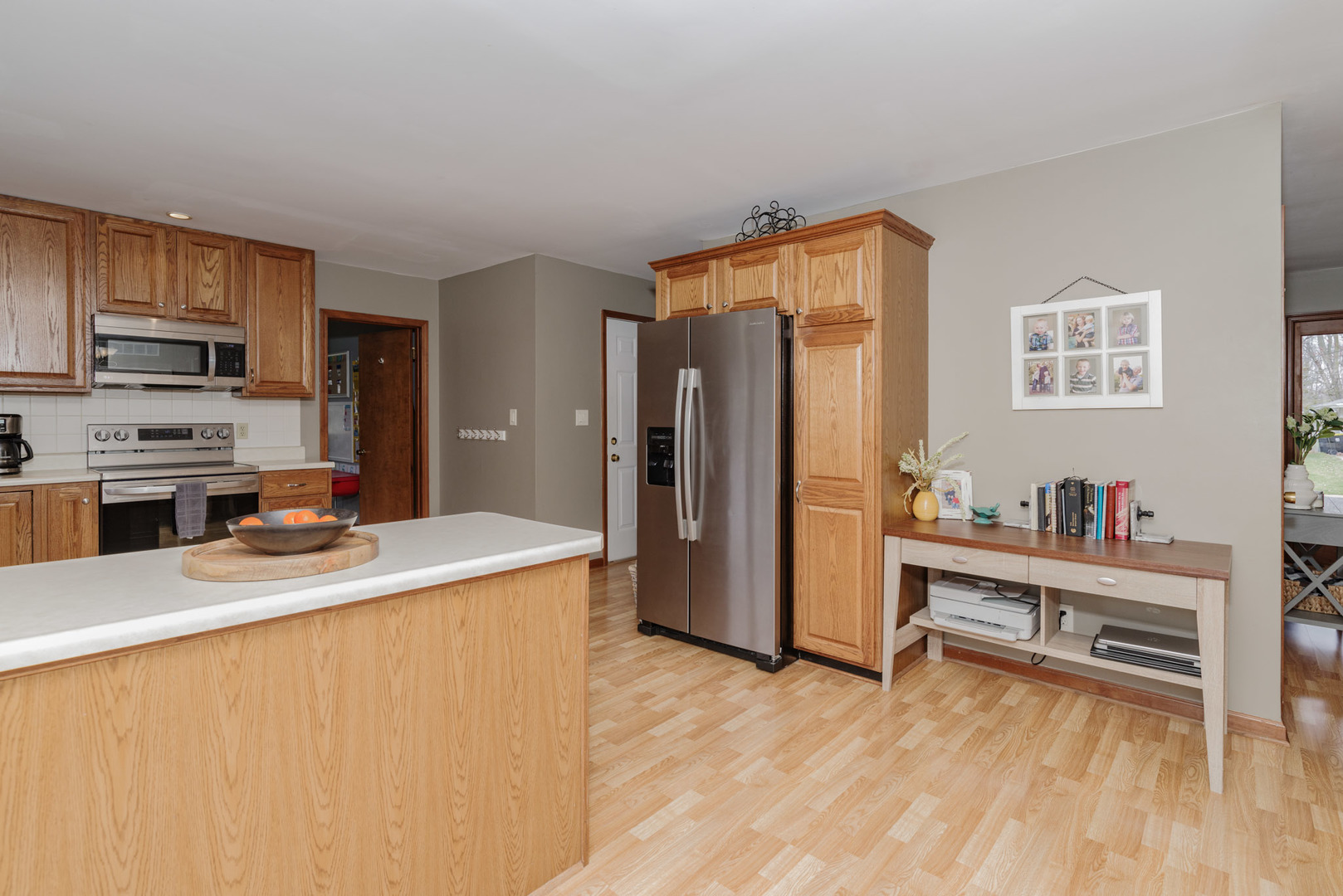 15 Robinwood Drive Normal, IL 61761 - Photo 8 of 35 a kitchen with stainless steel appliances a refrigerator and a stove top oven