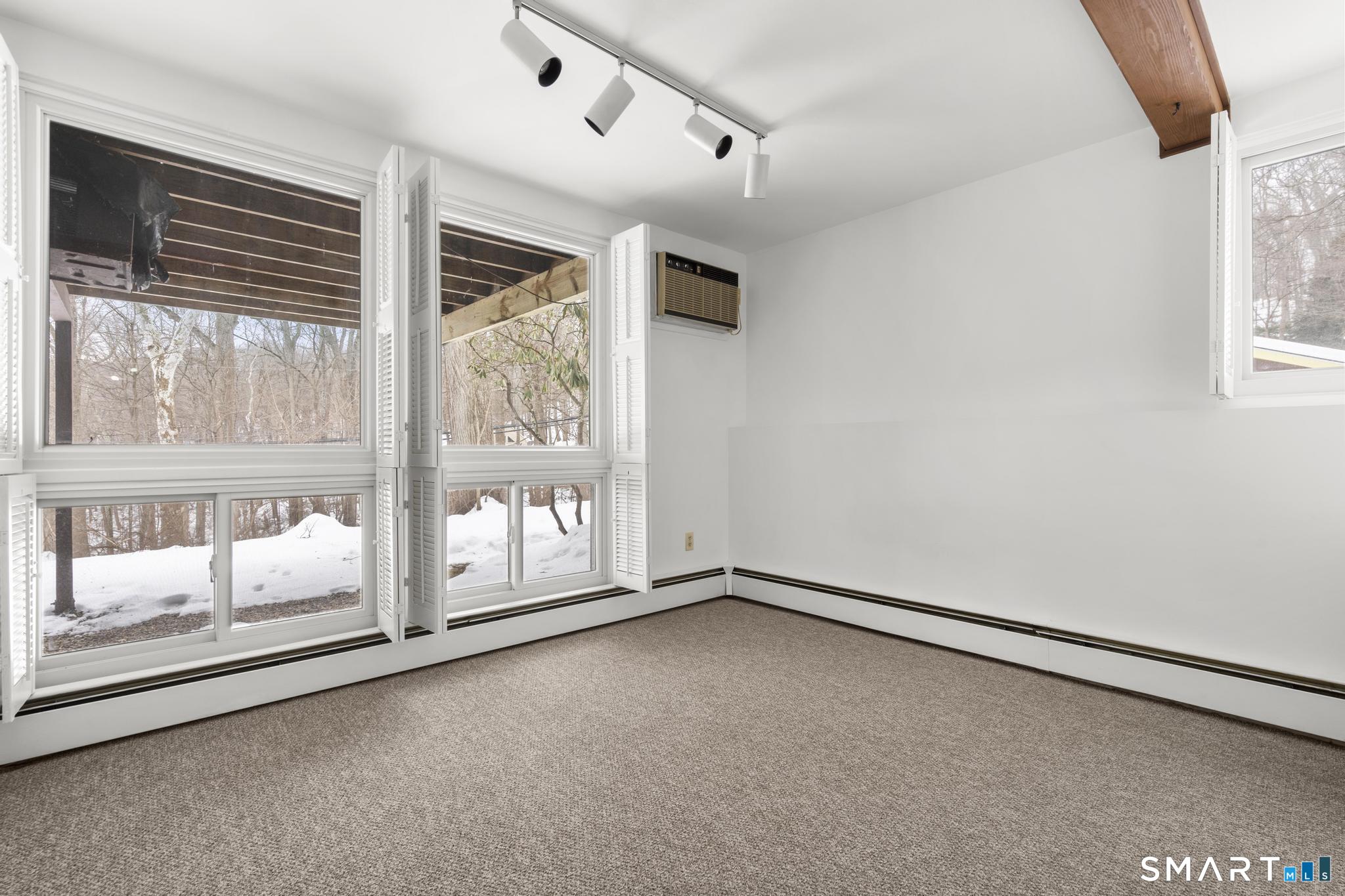 304 Olmstead Hill Road Wilton, CT 06897 - Photo 13 of 35 a view of an empty room with a window