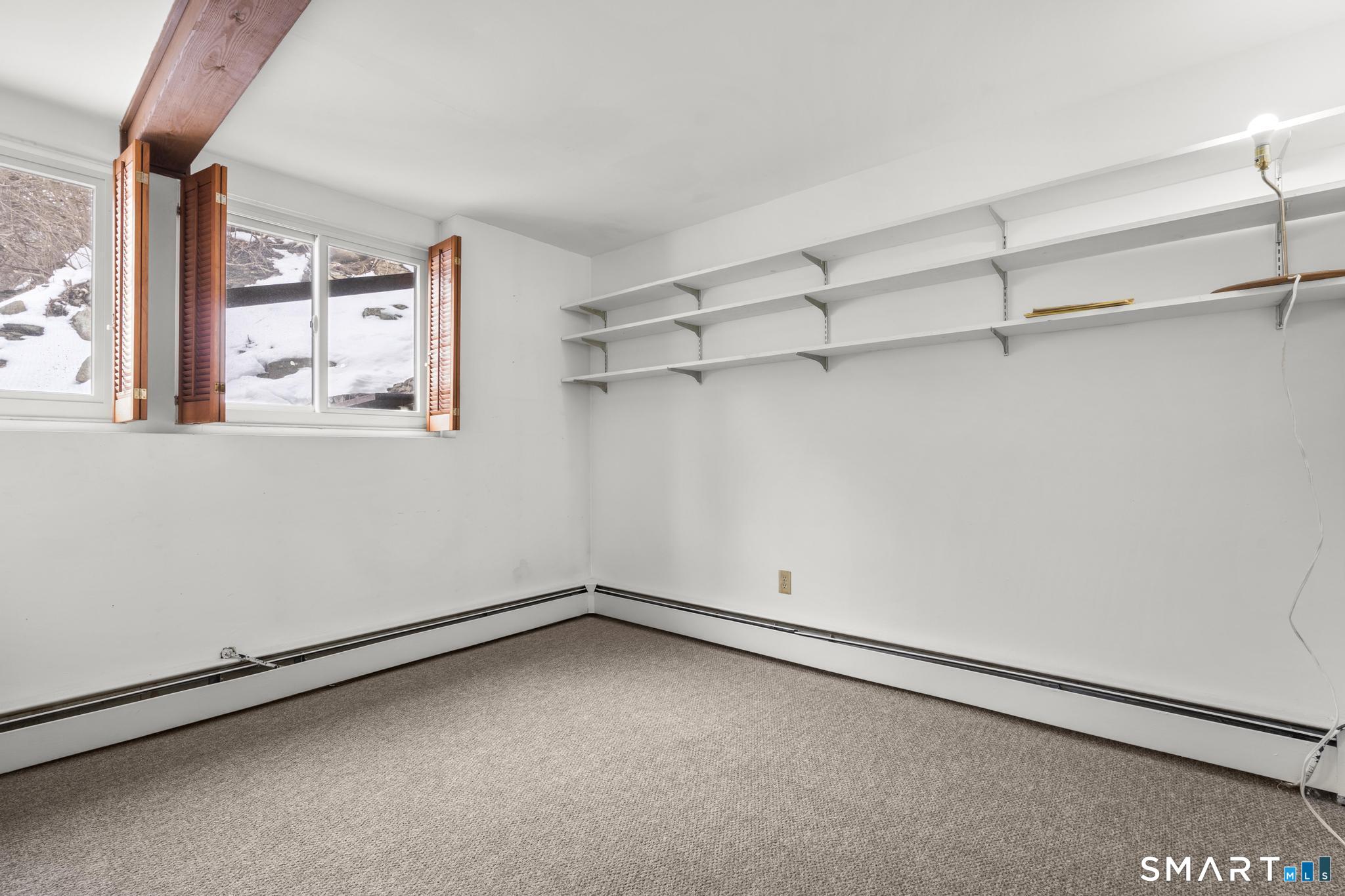 304 Olmstead Hill Road Wilton, CT 06897 - Photo 14 of 35 a view of a room with racks on the wall
