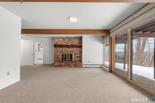 a kitchen with granite countertop a sink appliances counter top space and stainless steel appliances