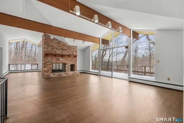 a view of an entryway with wooden floor