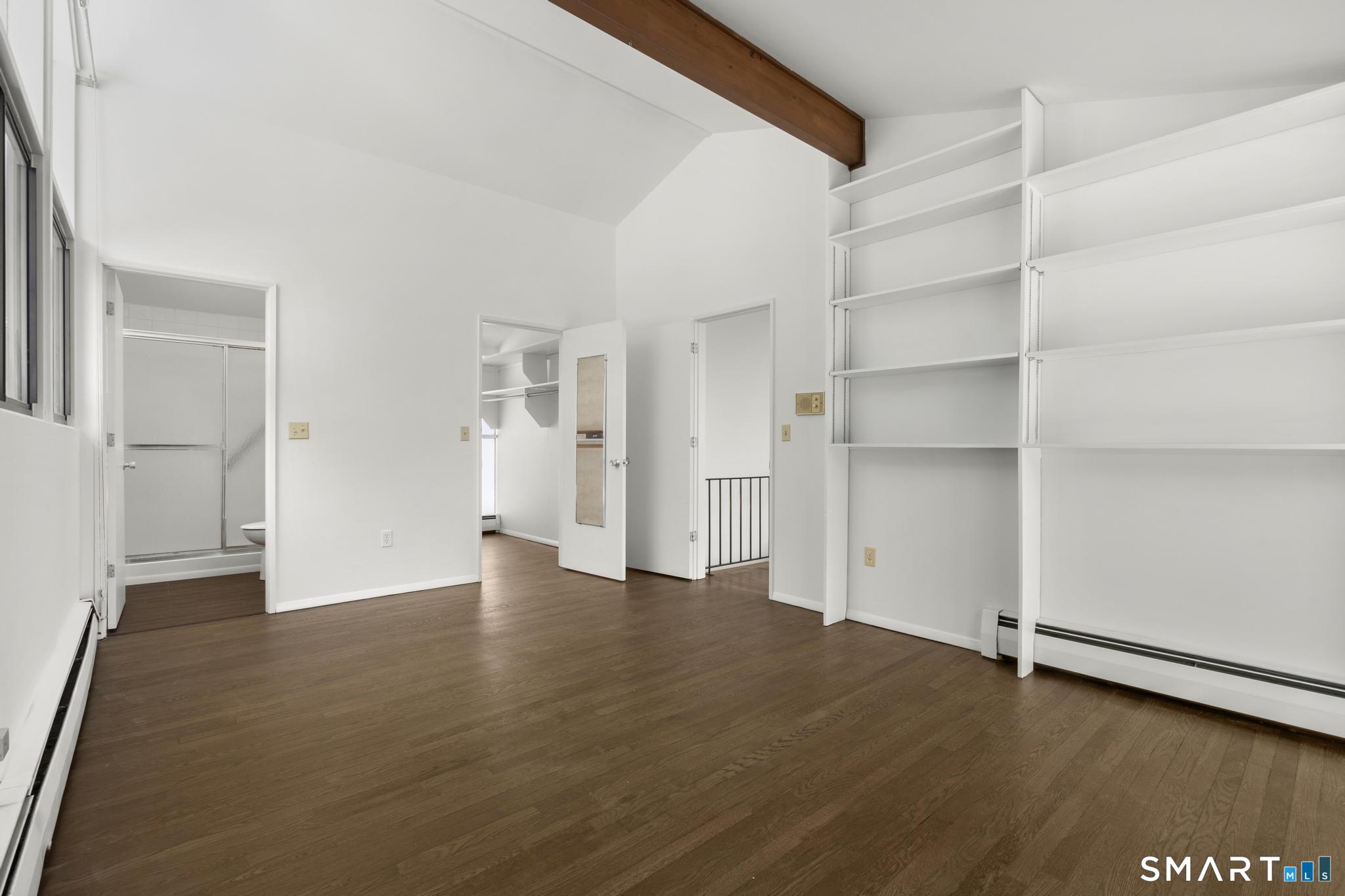 304 Olmstead Hill Road Wilton, CT 06897 - Photo 25 of 35 a view of an empty room with wooden floor and closet