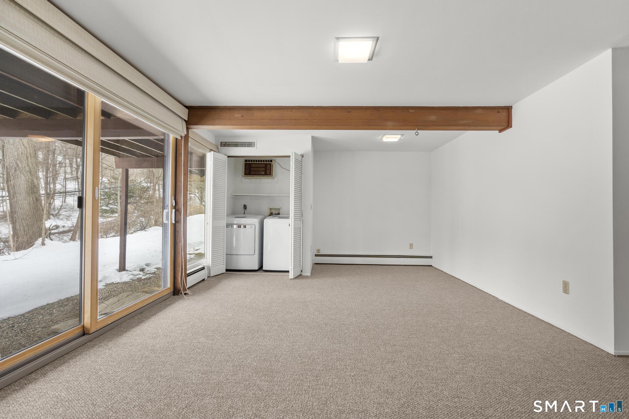 304 Olmstead Hill Road Wilton, CT 06897 - Photo 28 of 35 a view of a room with an empty room