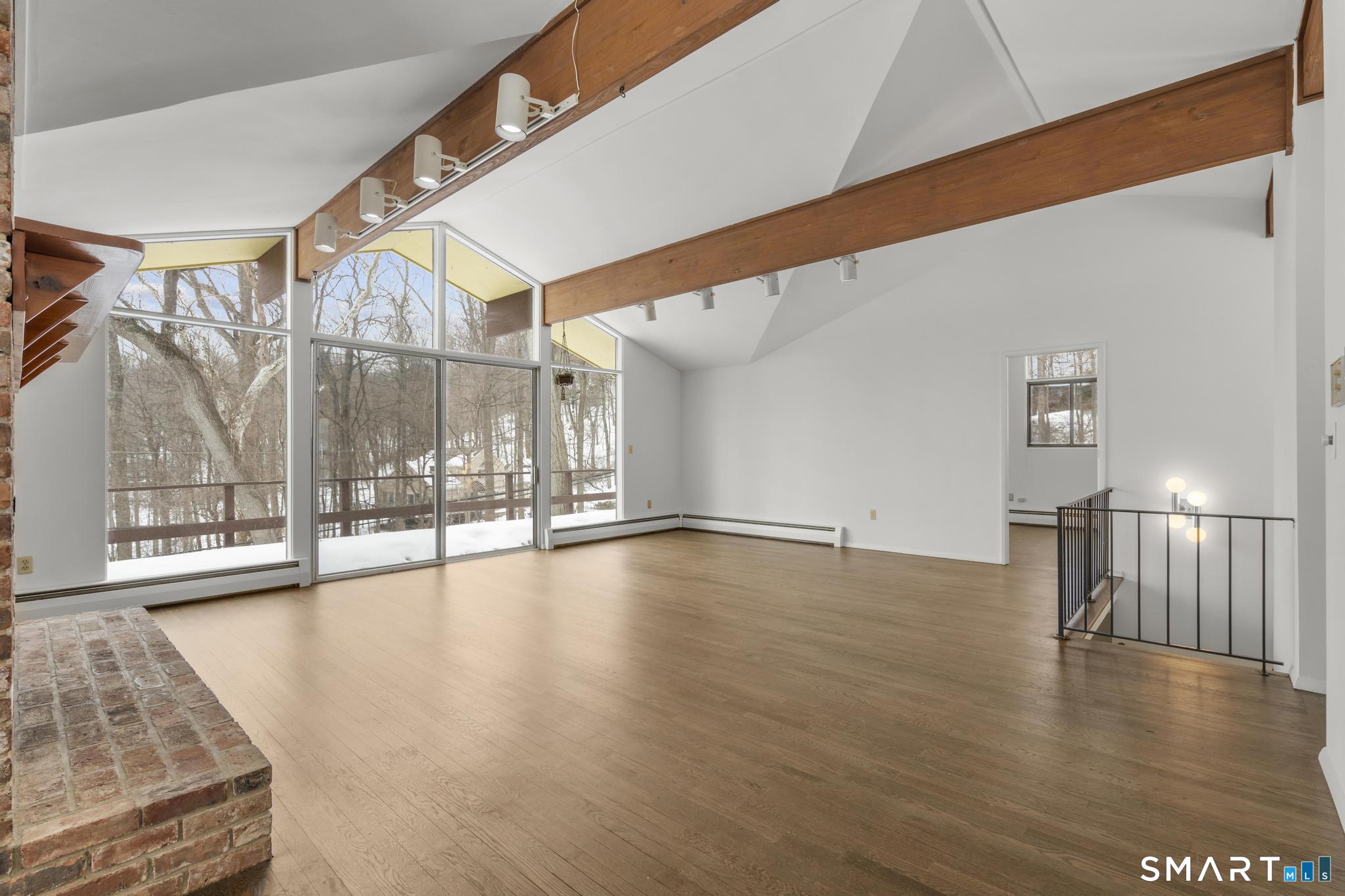 304 Olmstead Hill Road Wilton, CT 06897 - Photo 5 of 35 a view of an empty room with glass door