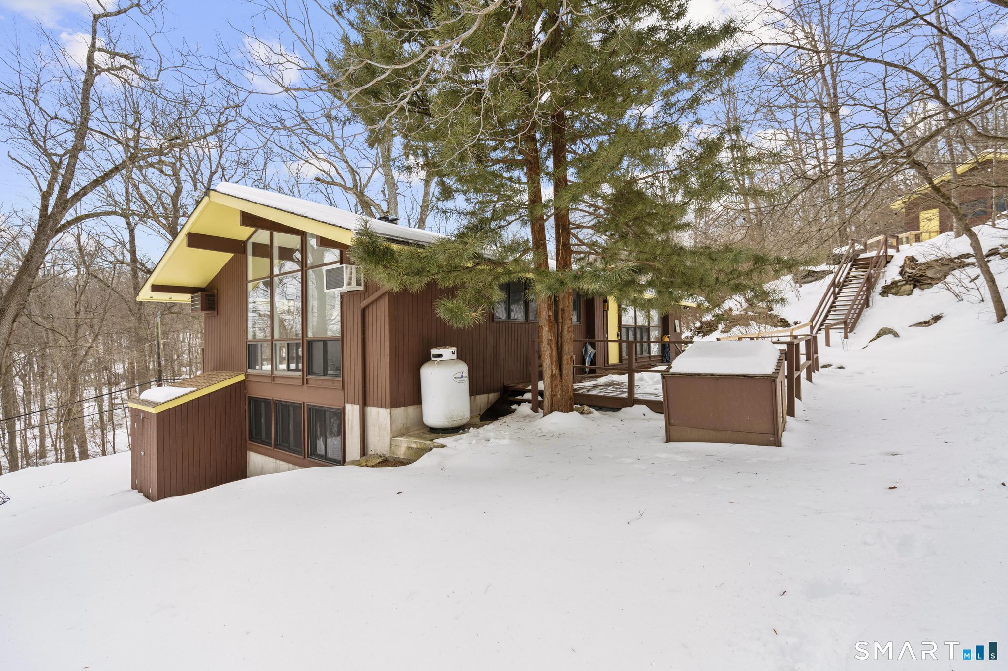 304 Olmstead Hill Road Wilton, CT 06897 - Photo 8 of 35 a view of a house with a snow