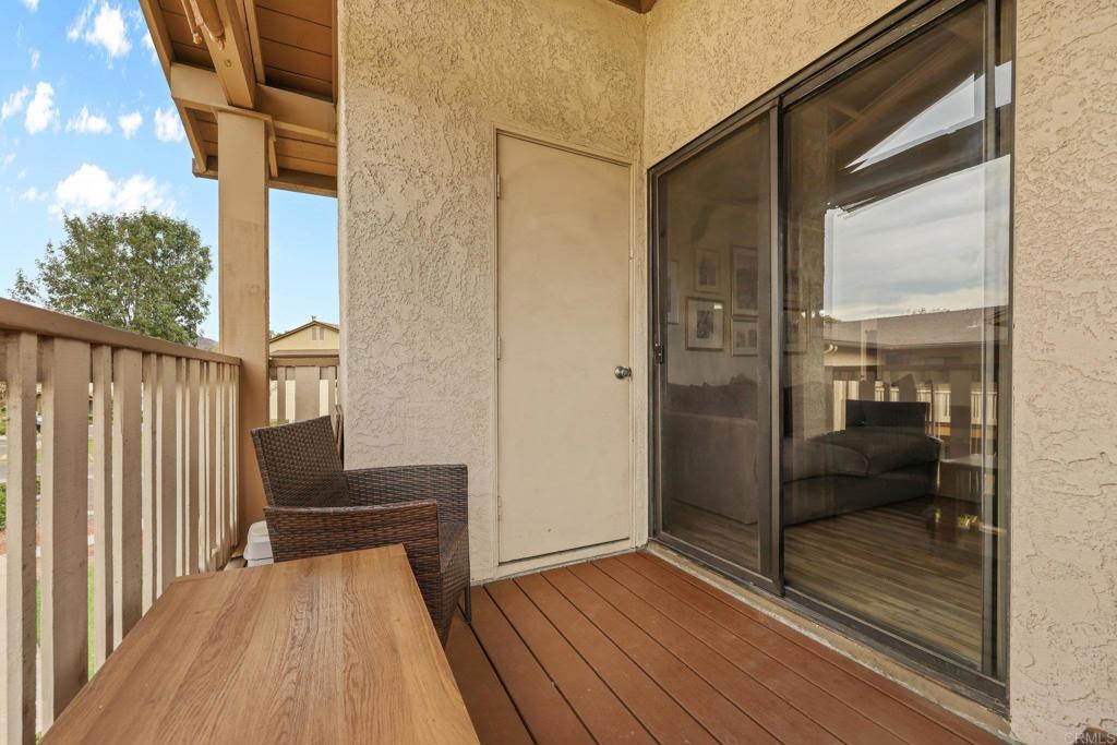1423 Graves Avenue, Unit 238 El Cajon, CA 92021 - Photo 12 of 25 a view of a balcony with wooden floor and furniture