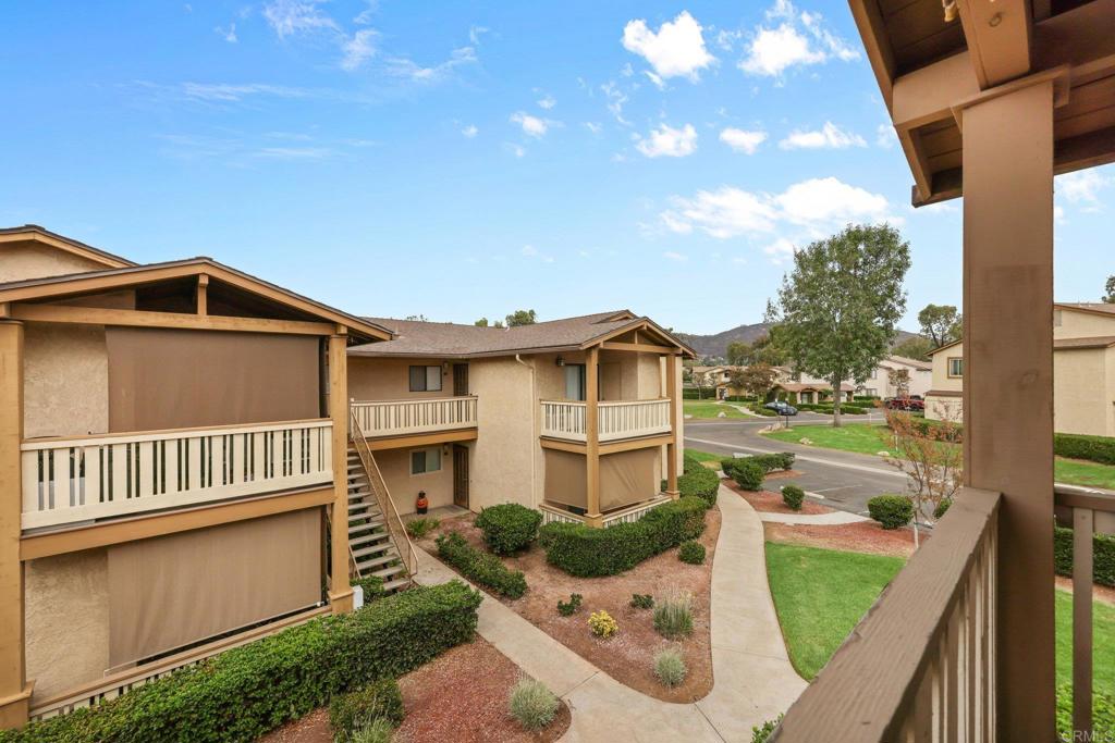 1423 Graves Avenue, Unit 238 El Cajon, CA 92021 - Photo 13 of 25 a front view of a house with a yard table and chairs