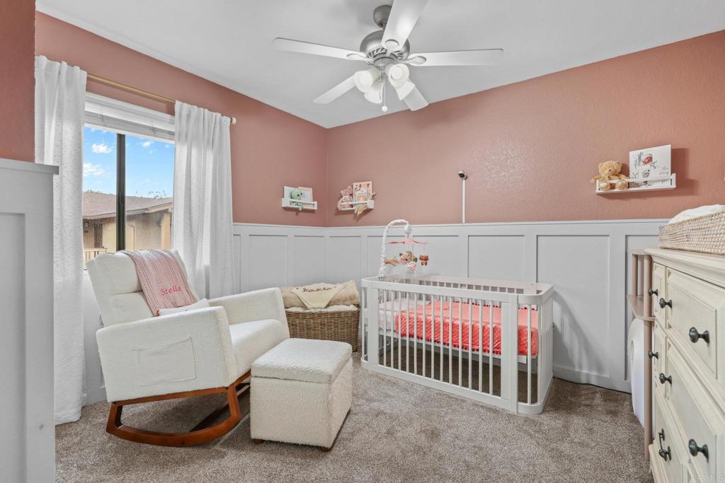 1423 Graves Avenue, Unit 238 El Cajon, CA 92021 - Photo 18 of 25 a bedroom with a bed and a couch