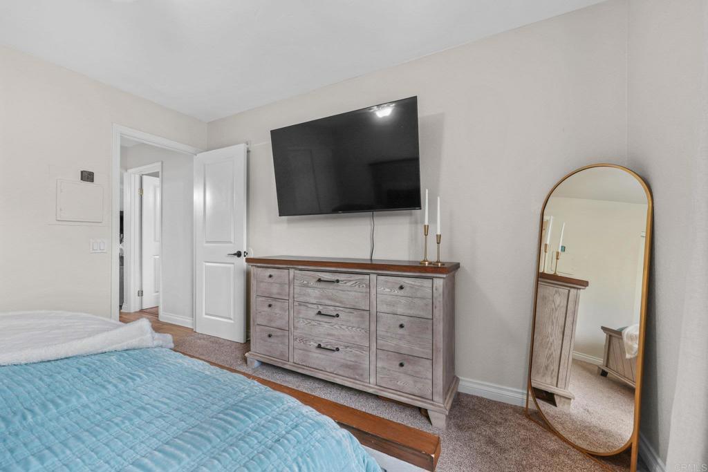 1423 Graves Avenue, Unit 238 El Cajon, CA 92021 - Photo 23 of 25 a living room with furniture and a flat screen tv