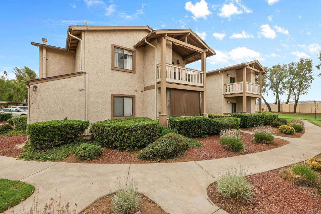 1423 Graves Avenue, Unit 238 El Cajon, CA 92021 - Photo 5 of 25 a front view of a house with garden
