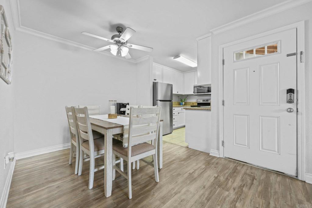 1423 Graves Avenue, Unit 238 El Cajon, CA 92021 - Photo 9 of 25 a view of a dining room with furniture and wooden floor
