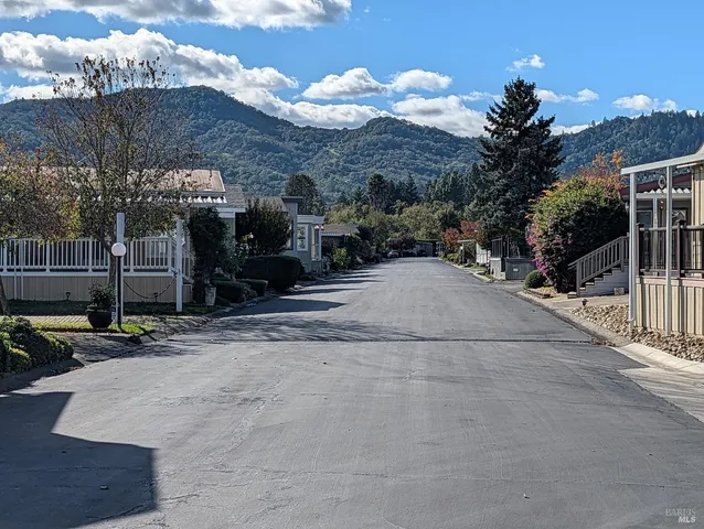 a view of a street with a building in the background