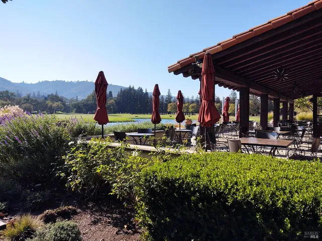 a view of a backyard with sitting area