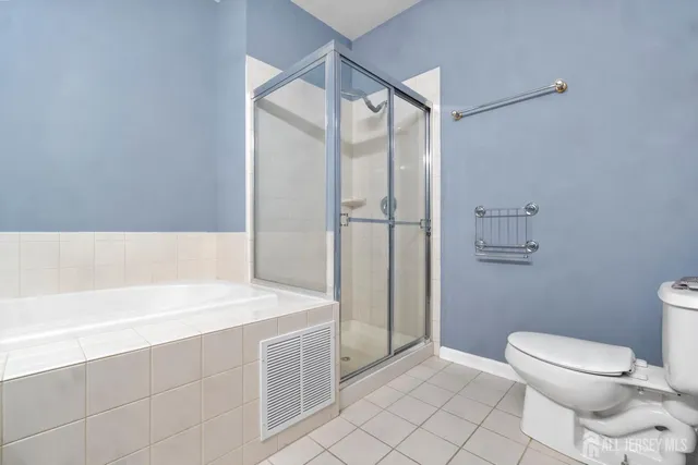 a bathroom with a toilet and a bathtub