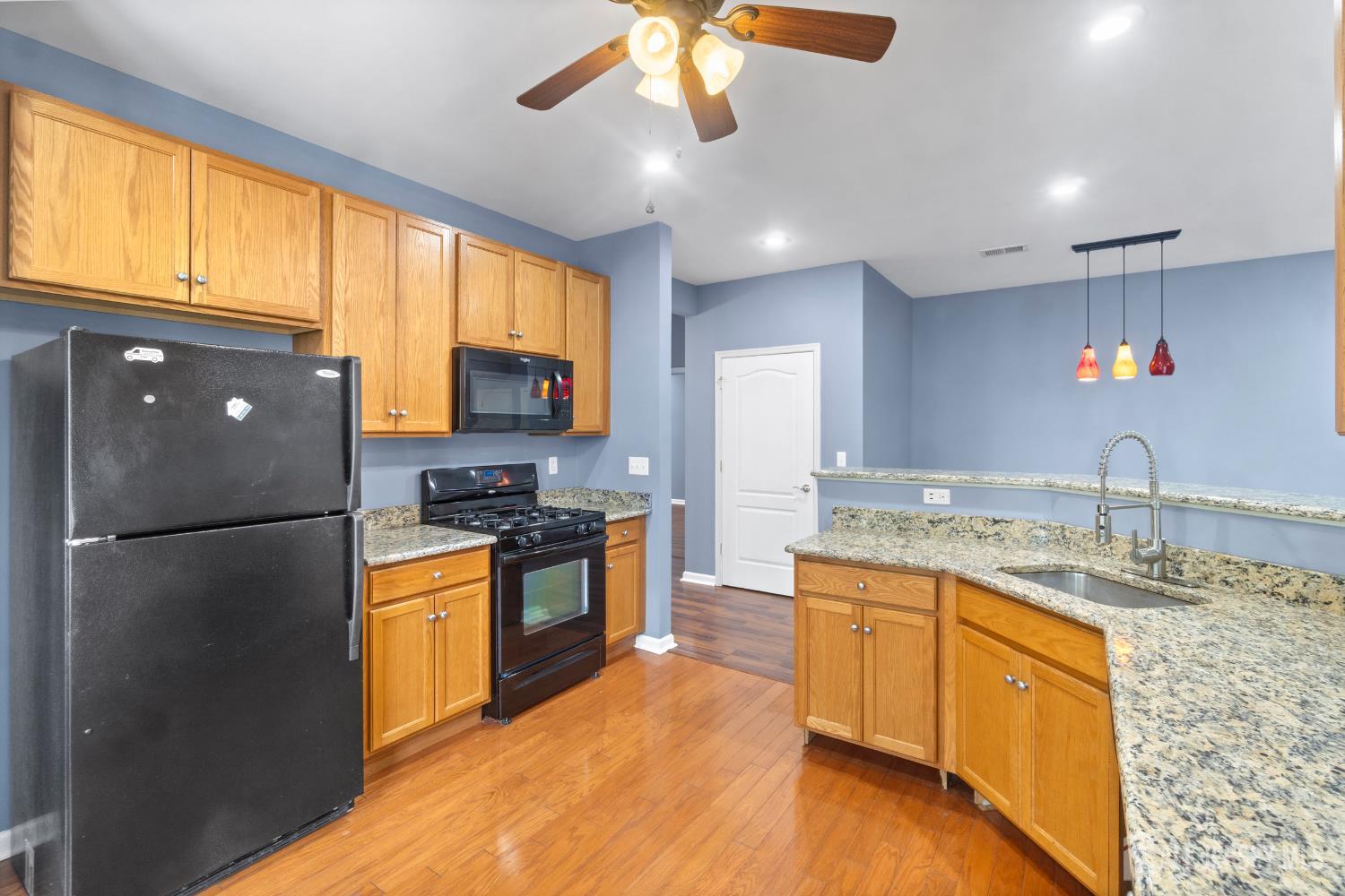 41 Azalea Drive Old Bridge, NJ 08857 - Photo 5 of 18 a kitchen with stainless steel appliances granite countertop a refrigerator a sink dishwasher a stove with wooden cabinets and floor