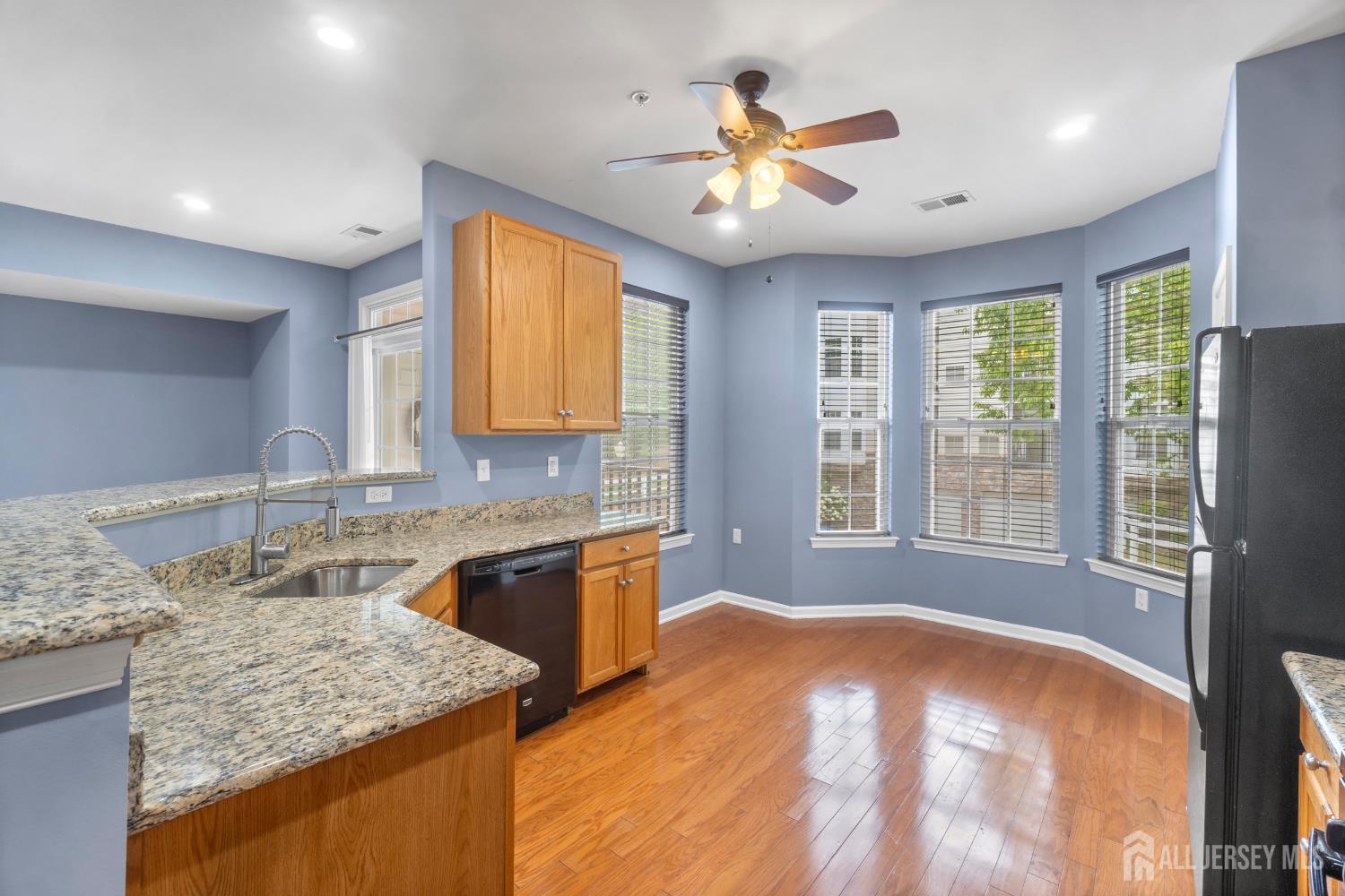 41 Azalea Drive Old Bridge, NJ 08857 - Photo 6 of 18 a bathroom with a granite countertop sink a bathtub and a large mirror