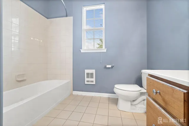 a bathroom with a toilet a sink and a bathtub