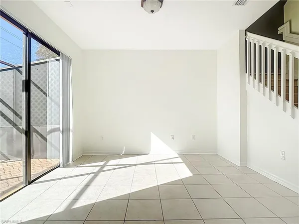 a bathroom with a granite countertop sink mirror vanity and toilet