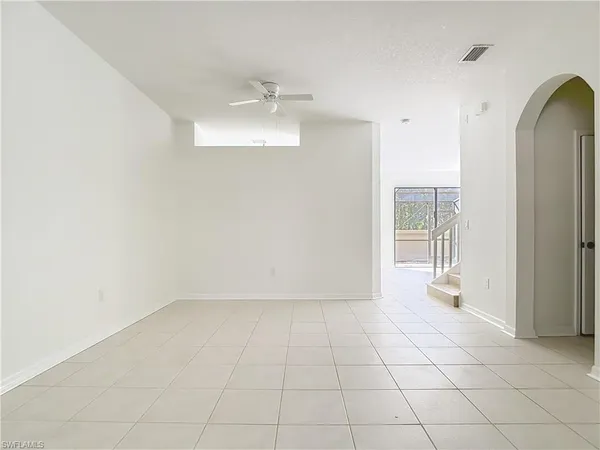 a kitchen with cabinets appliances a sink and a window