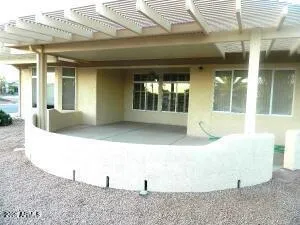 a view of a patio with couches and table and chairs