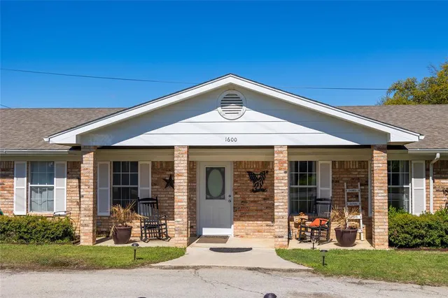 a front view of a house with a patio