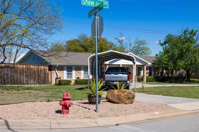 a house view with a garden space