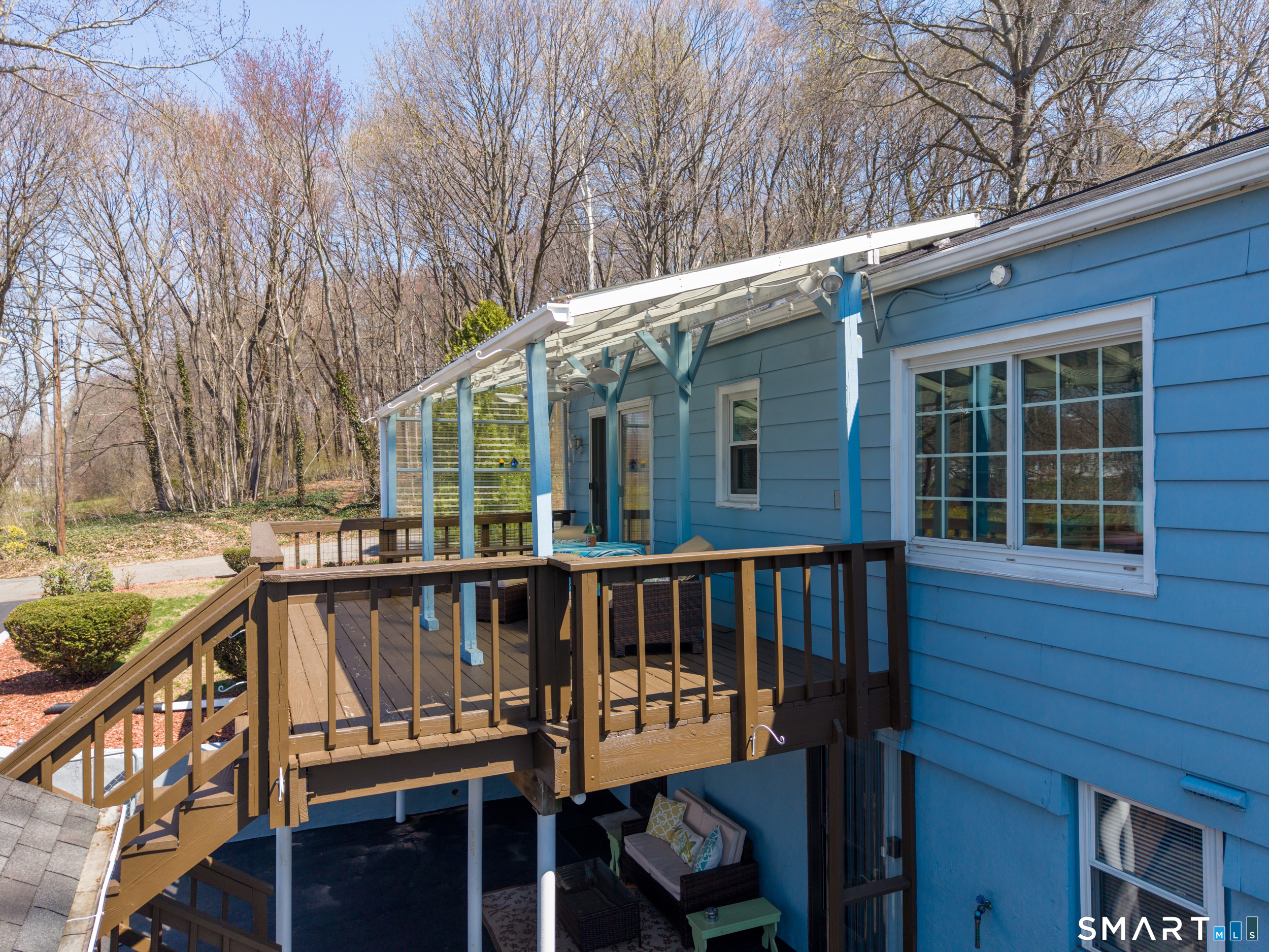 30 Lucy Street Hamden, CT 06514 - Photo 18 of 46 a view of a house with a wooden deck and a barbeque