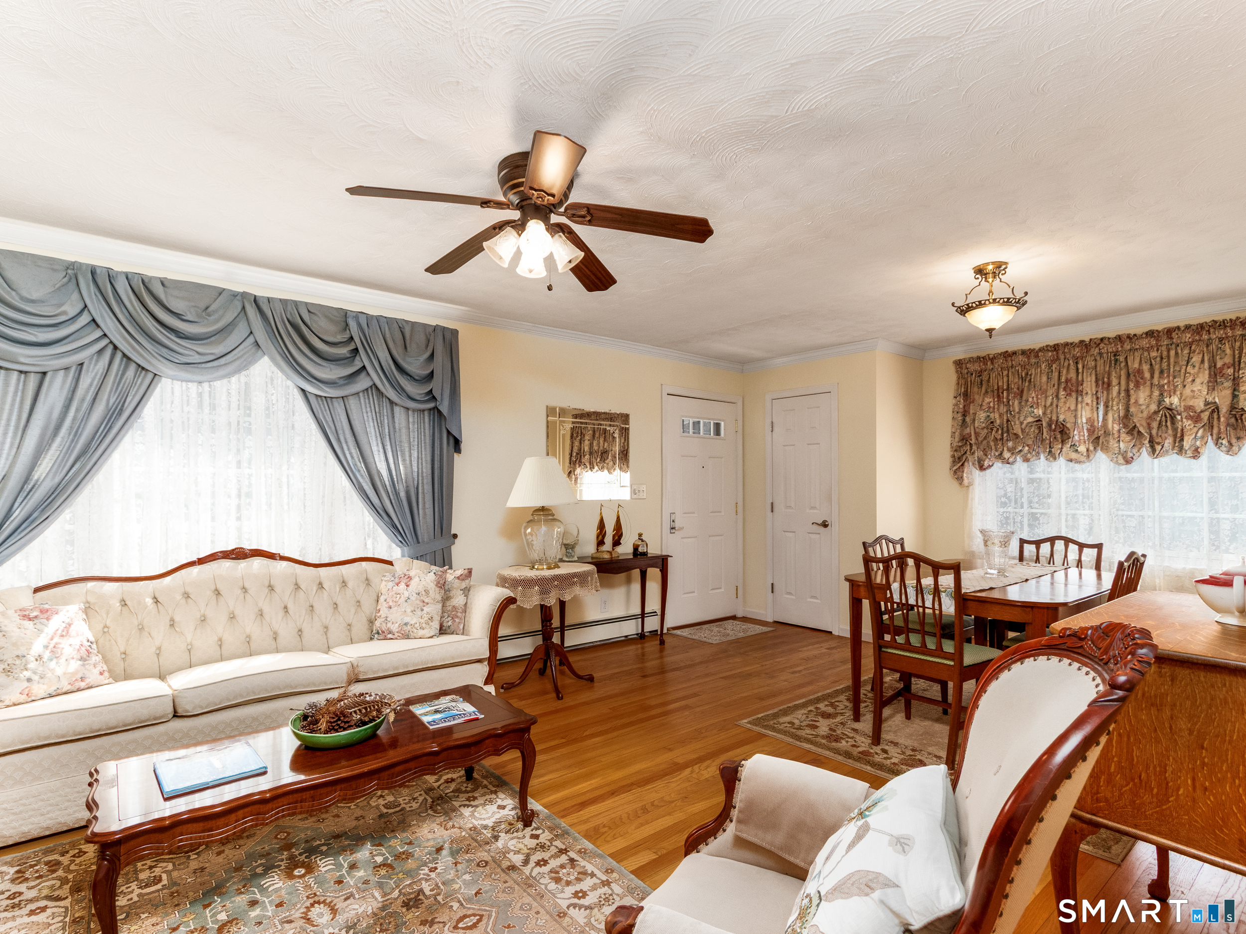 30 Lucy Street Hamden, CT 06514 - Photo 2 of 46 a living room with furniture and a wooden floor