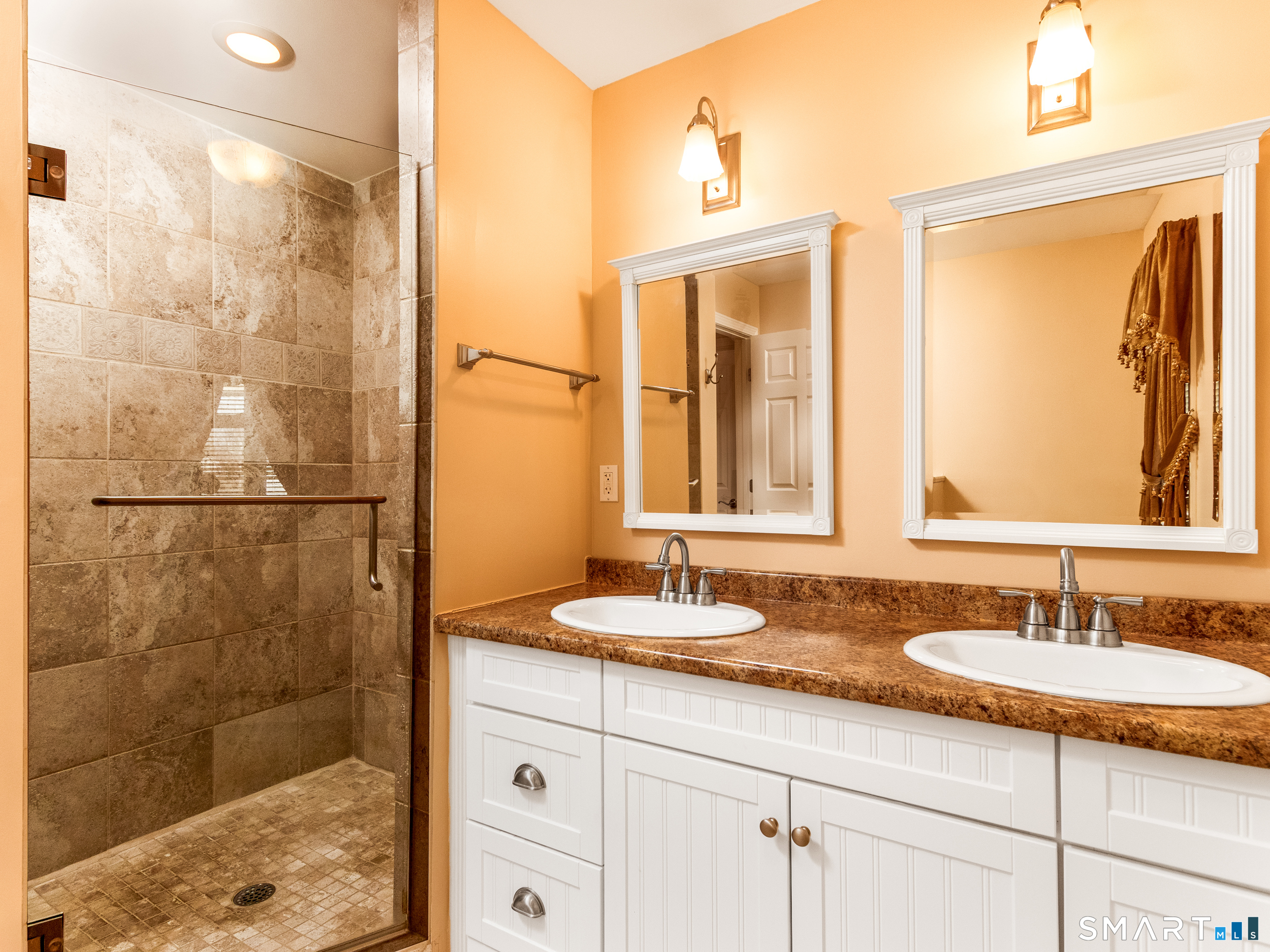 30 Lucy Street Hamden, CT 06514 - Photo 3 of 46 a bathroom with a granite countertop sink a mirror and a shower
