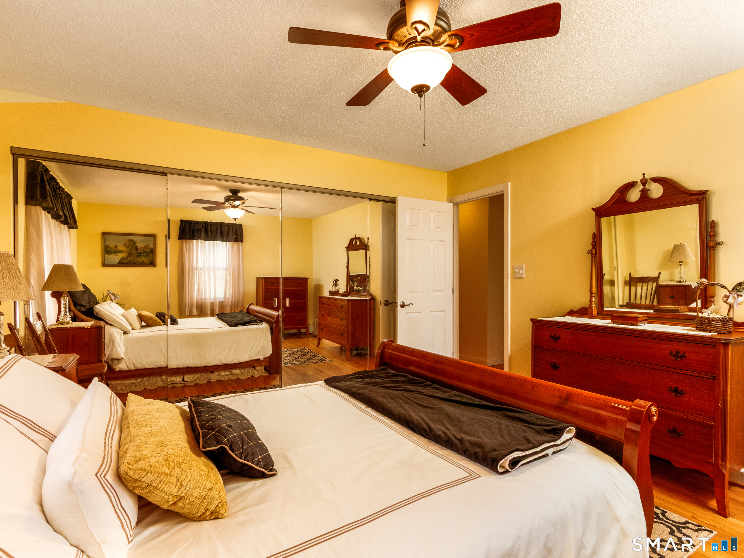 30 Lucy Street Hamden, CT 06514 - Photo 34 of 46 a bed room with a bed and a chandelier